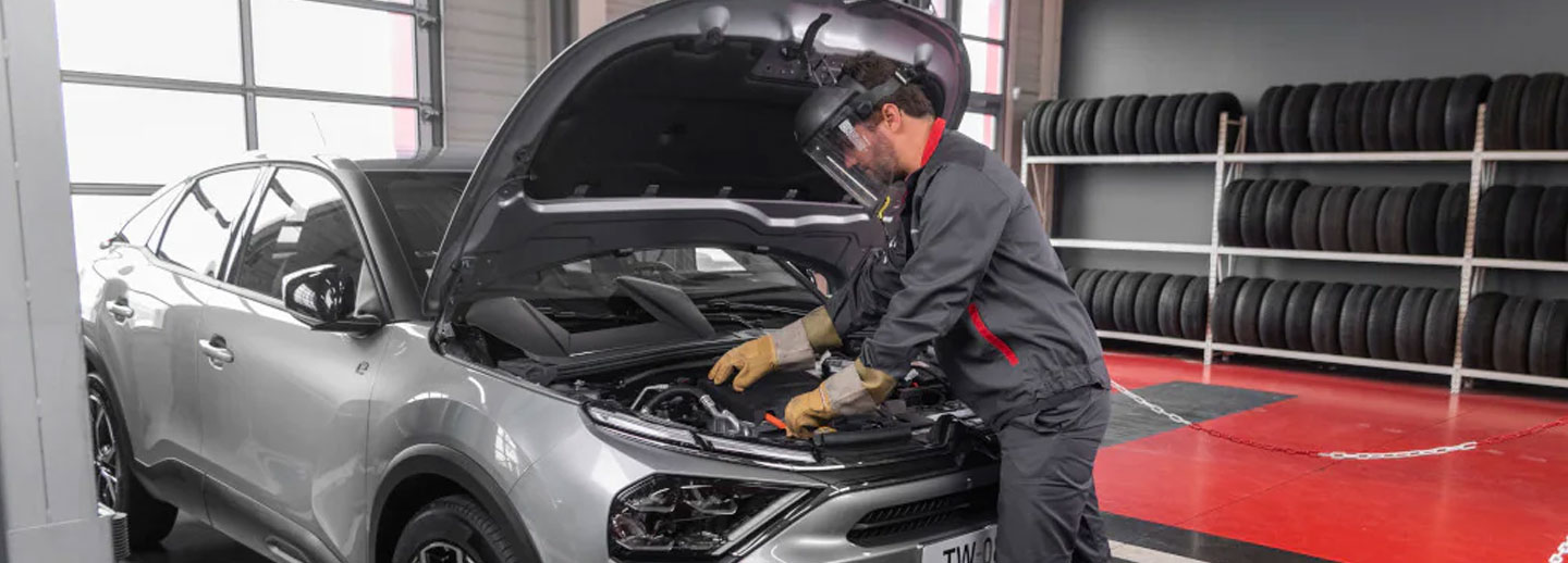 Approved technician servicing vehicle