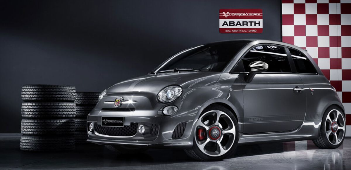 Original Grey Abarth surrounded by tyres
