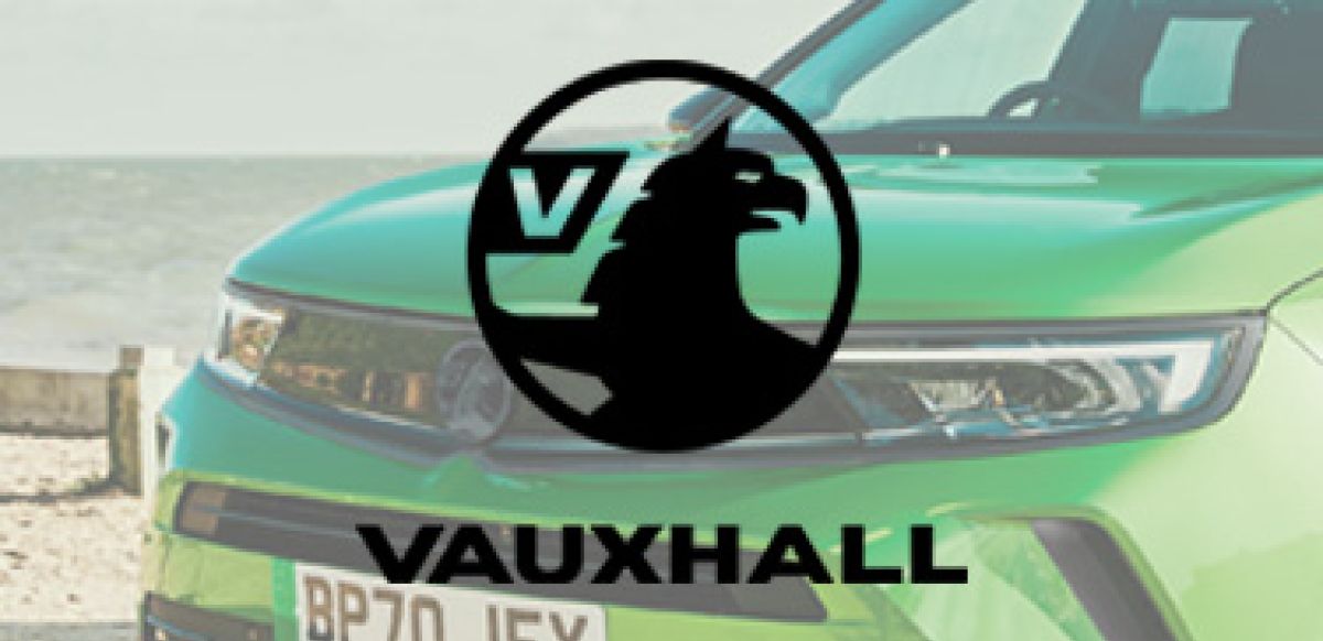 Greyscale Vauxhall logo with Vauxhall Mokka in the background