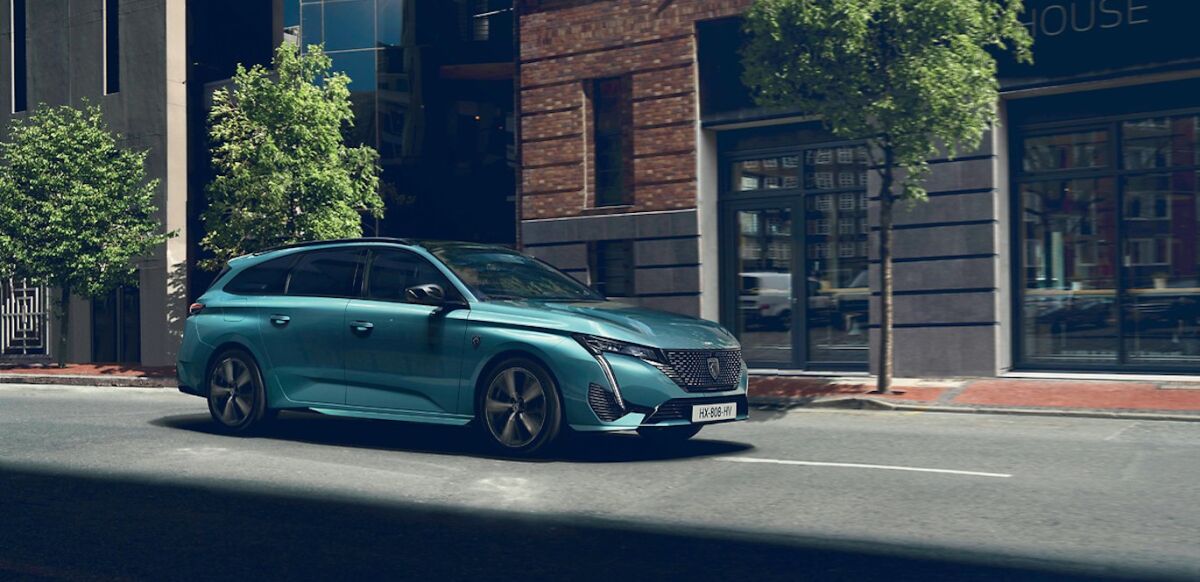 PEUGEOT 308 on a city road