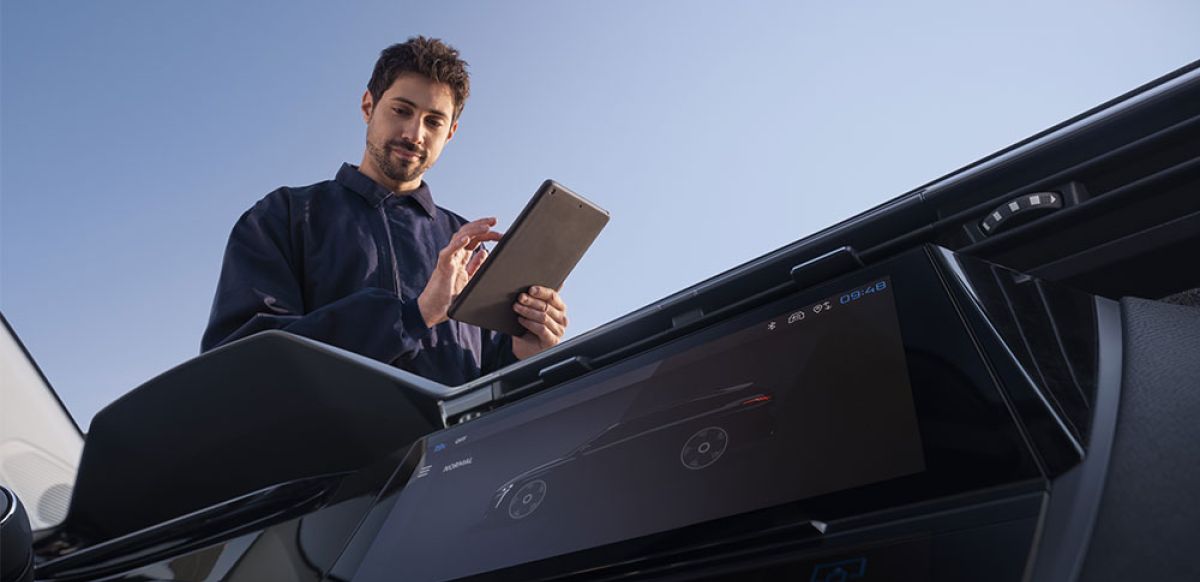 Technician completing inspection checks on a SPOTICAR vehicle