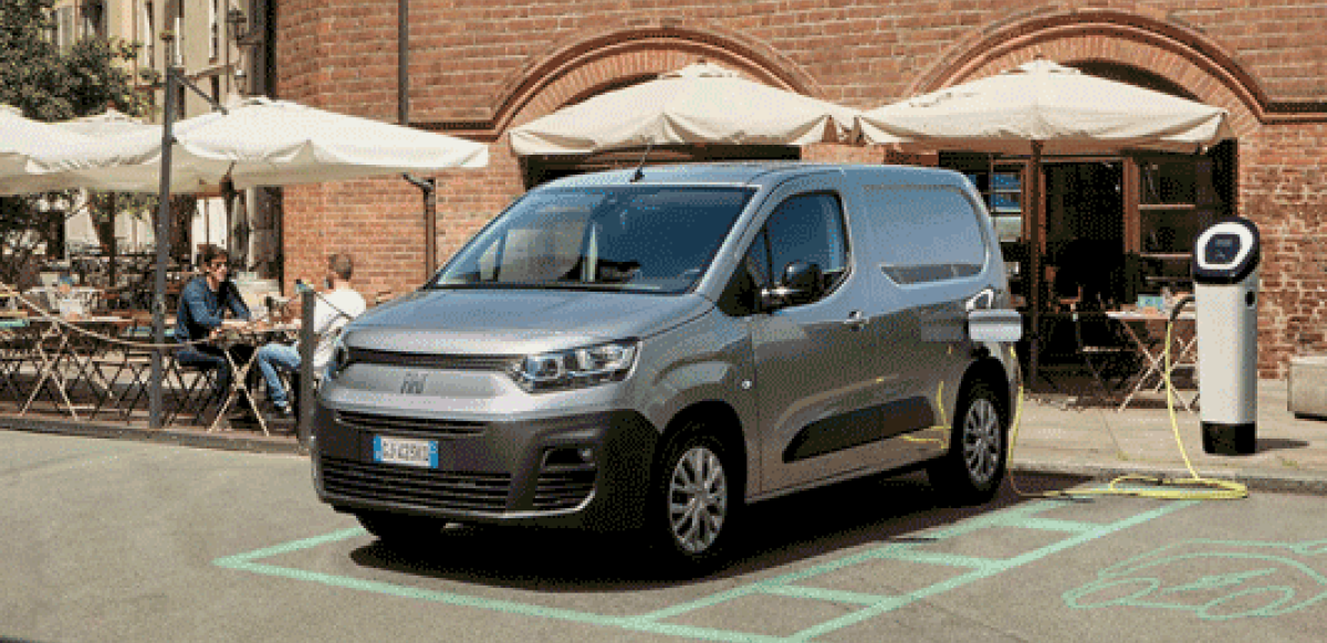 Doblo parked outside charging