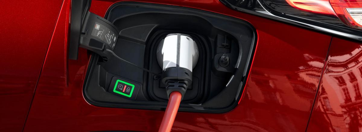 Electric car on charge using charging point