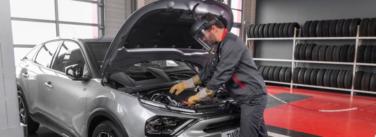 Approved technician servicing vehicle