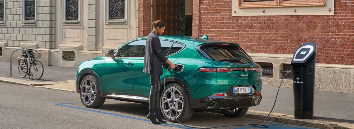 Hybrid Alfa Romeo being charged on the street