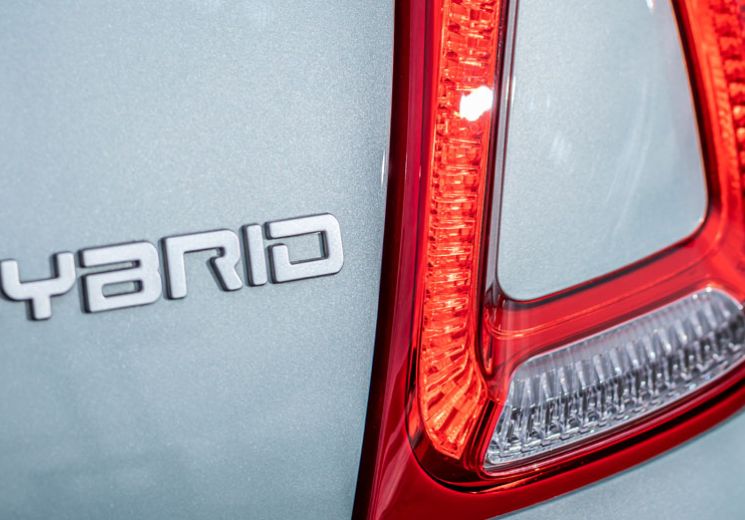 Hybrid car badge on Fiat 500