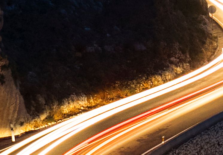 Orange glowing road through a mountain