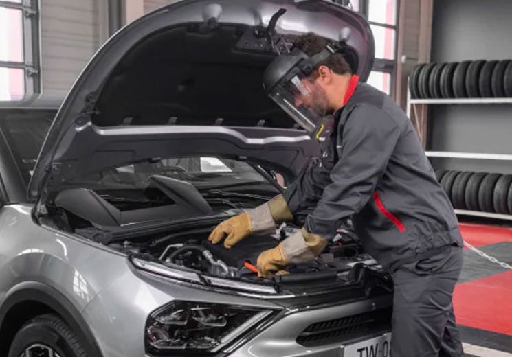 Approved technician servicing vehicle