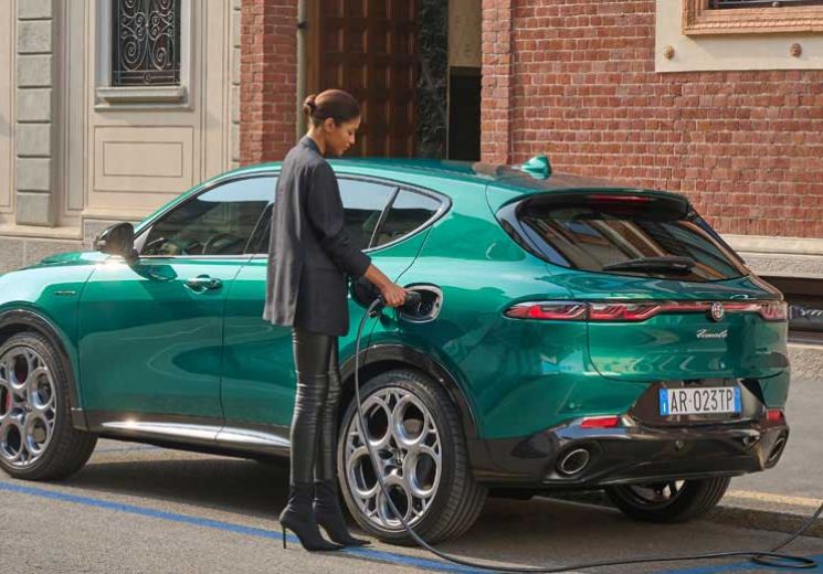 Hybrid Alfa Romeo being charged on the street