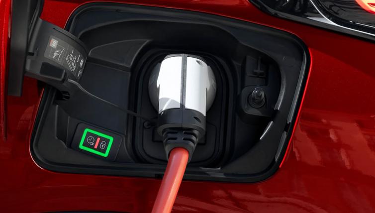 Electric car on charge using charging point