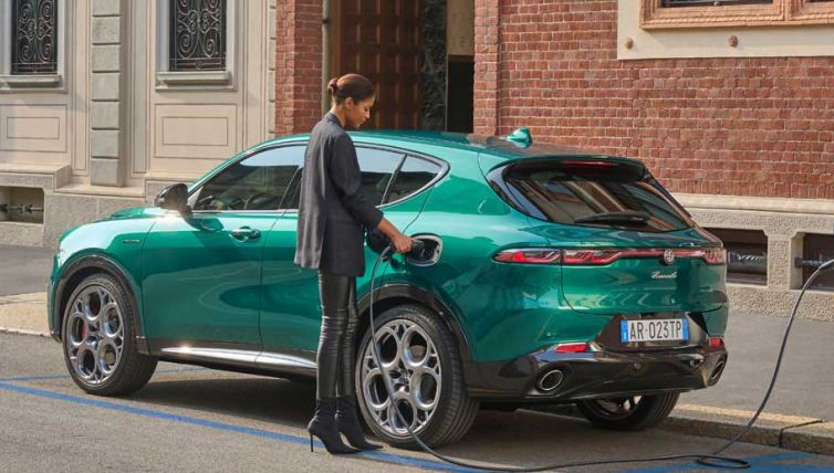 Hybrid Alfa Romeo being charged on the street