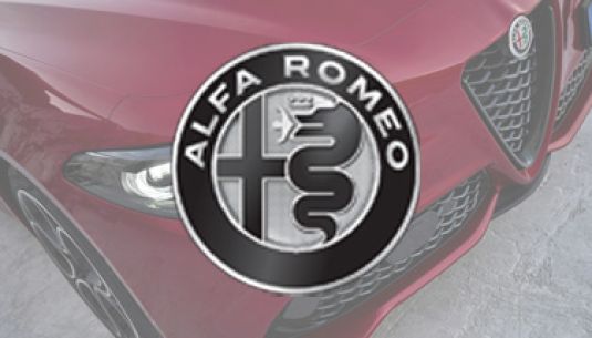 Greyscale Alfa Romeo logo with car in background