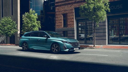 PEUGEOT 308 on a city road