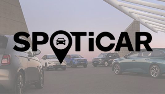 SPOTICAR logo over the range of vehicles on a bridge