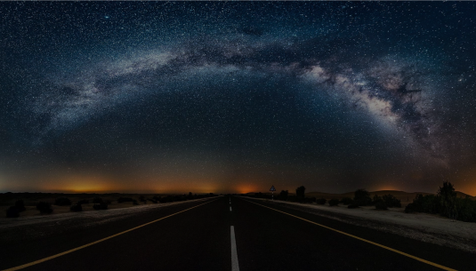 Starry road at night