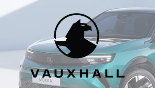 Black Vauxhall logo with Vauxhall Mokka in the background