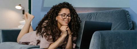 Smiling lady on her laptop