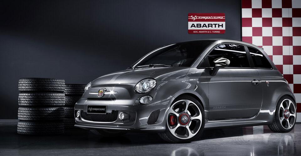 Original Grey Abarth surrounded by tyres