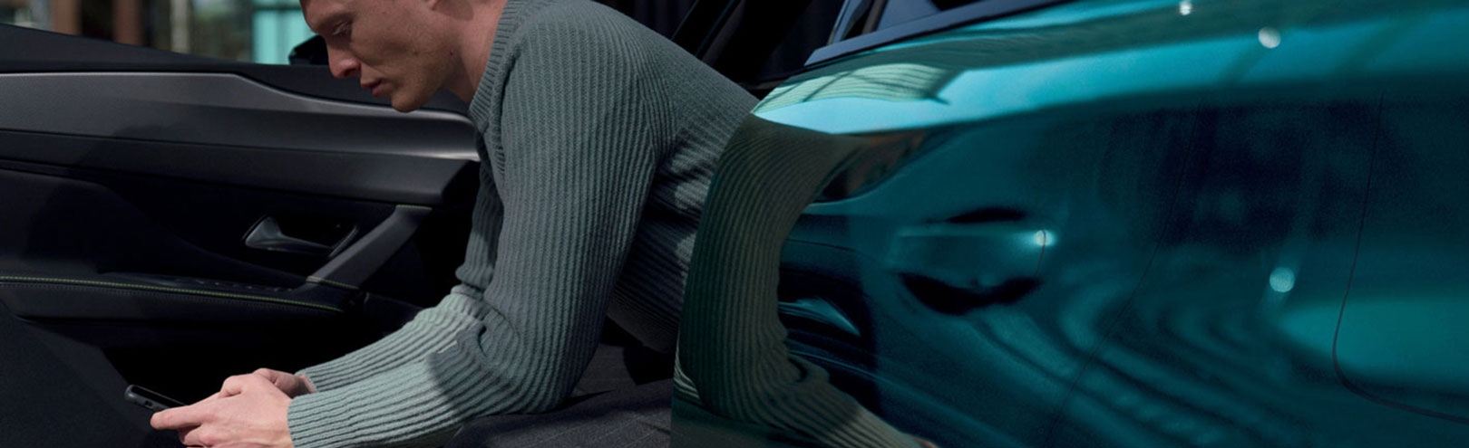 man sitting in stationary car